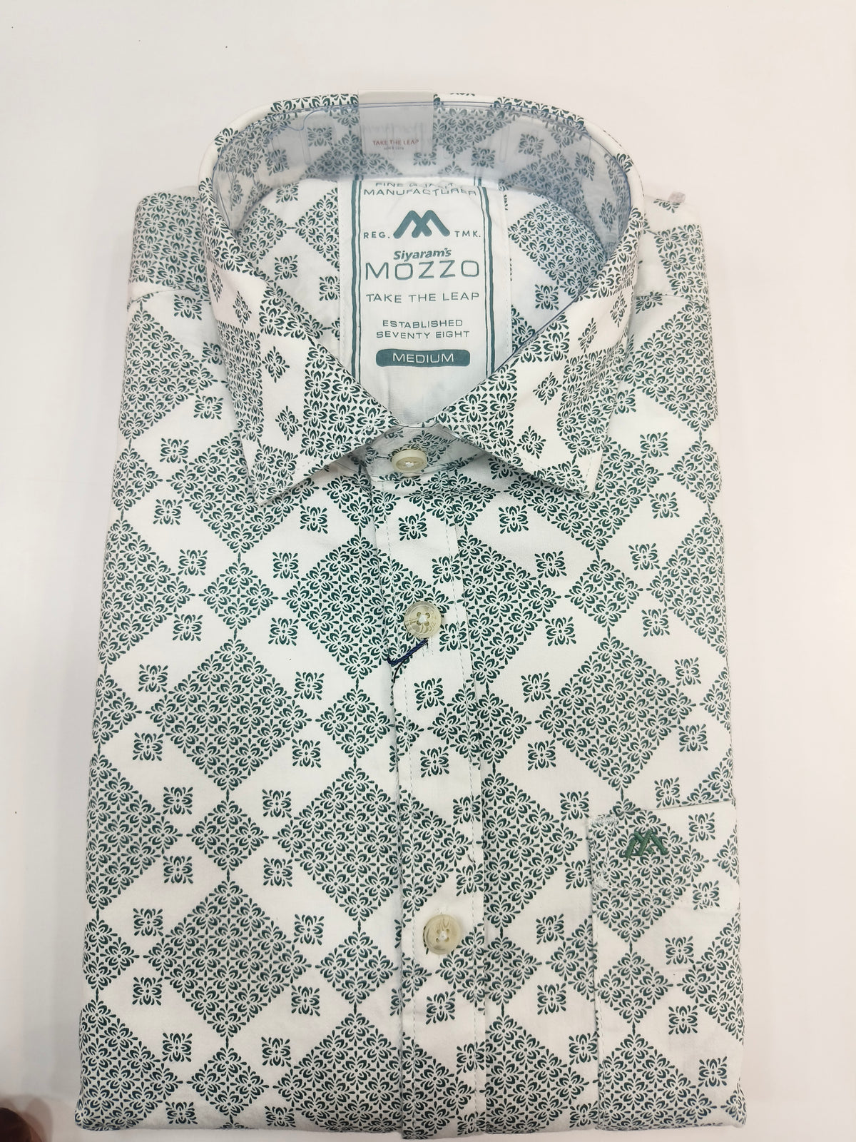Siyaram’s Mozzo Men’s Printed Cotton Shirt – White with Teal Floral Pattern