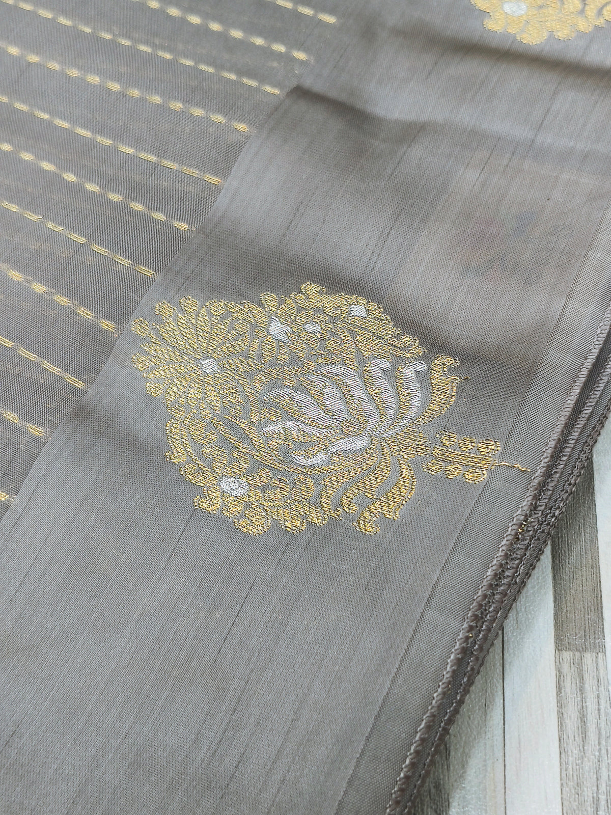 : Elegant Gold Butta Saree with Striped Design